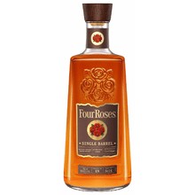 A bourbon bottle with a blank gift tag tied to its neck on a home bar